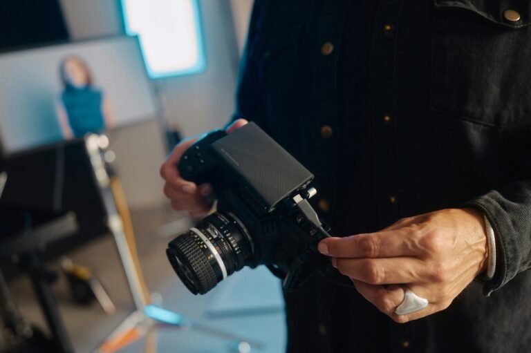 A man holding a camera in his hands